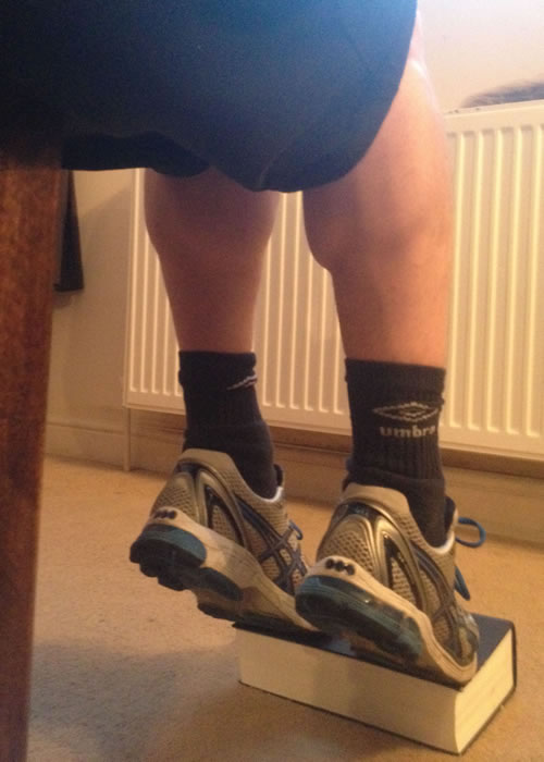Performing Seated Calf Raises at home.