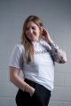 Power athlete, Liz, in the Classic T-Shirt in White. Size: Large. 